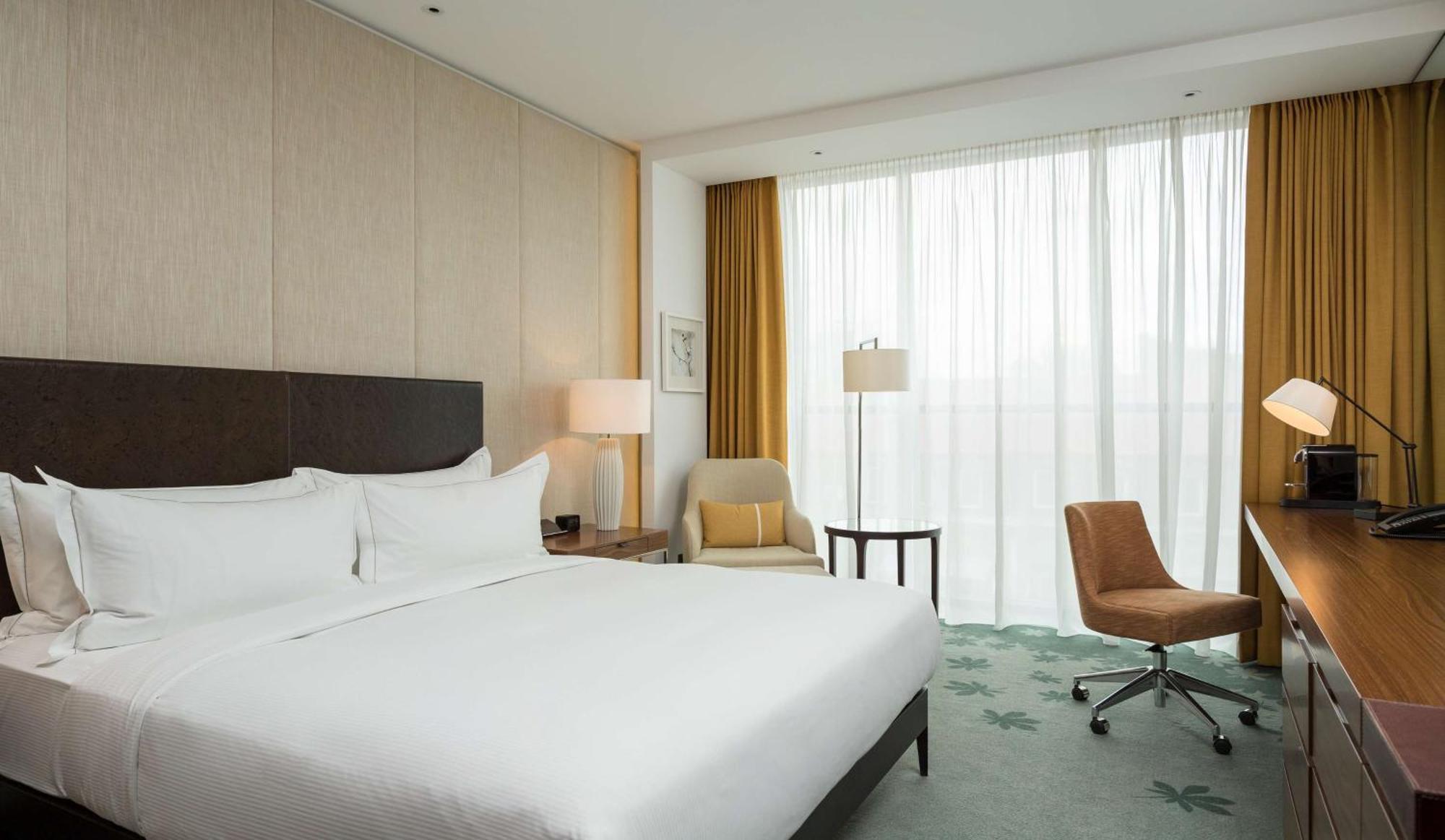 Habitación Executive con acceso al salón y cama extragrande