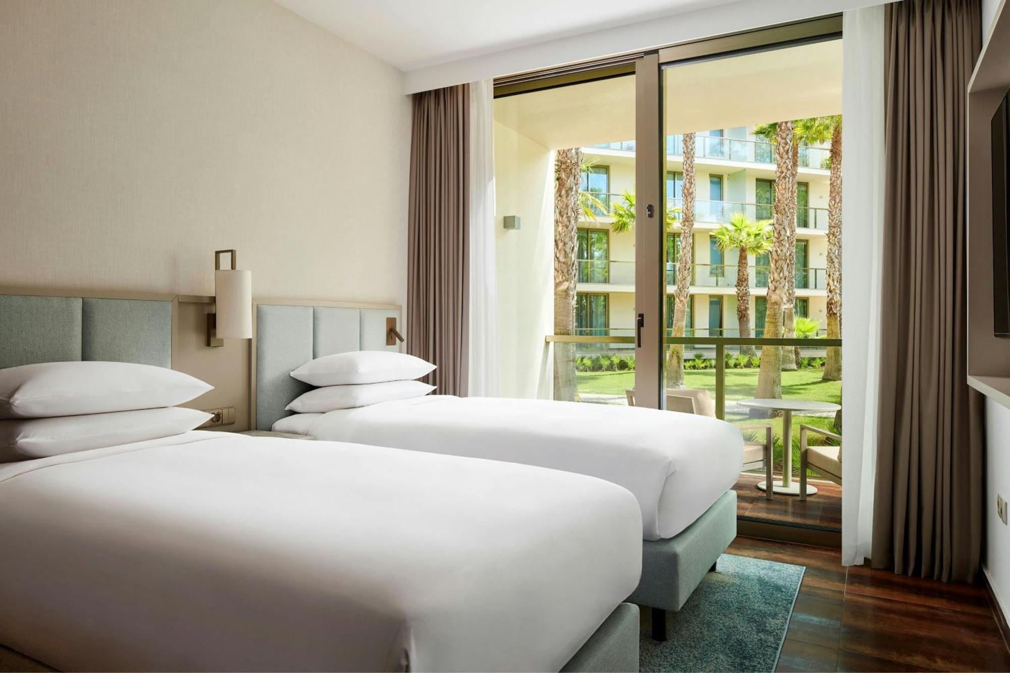 Three-Bedroom Suite Balcony Pool View